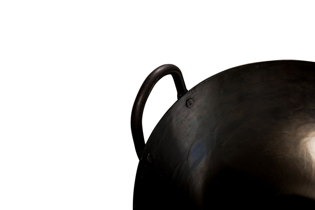 Metal handle of our traditionally hand-hammered pasoli wok.