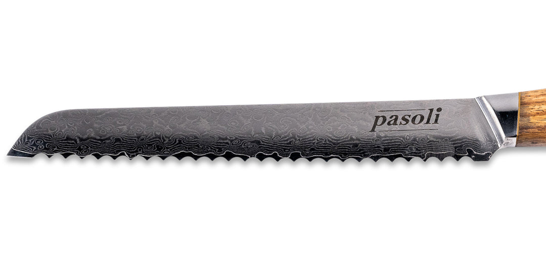 Beautiful grain of the damask blade of our pasoli damask bread knife including the pasoli logo.